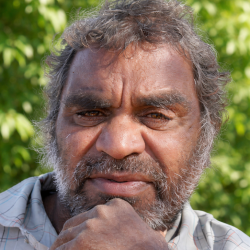 Portrait of Douglas Multa with leafy background