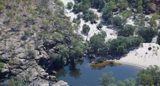 A small rockhole in a dry-looking river bed
